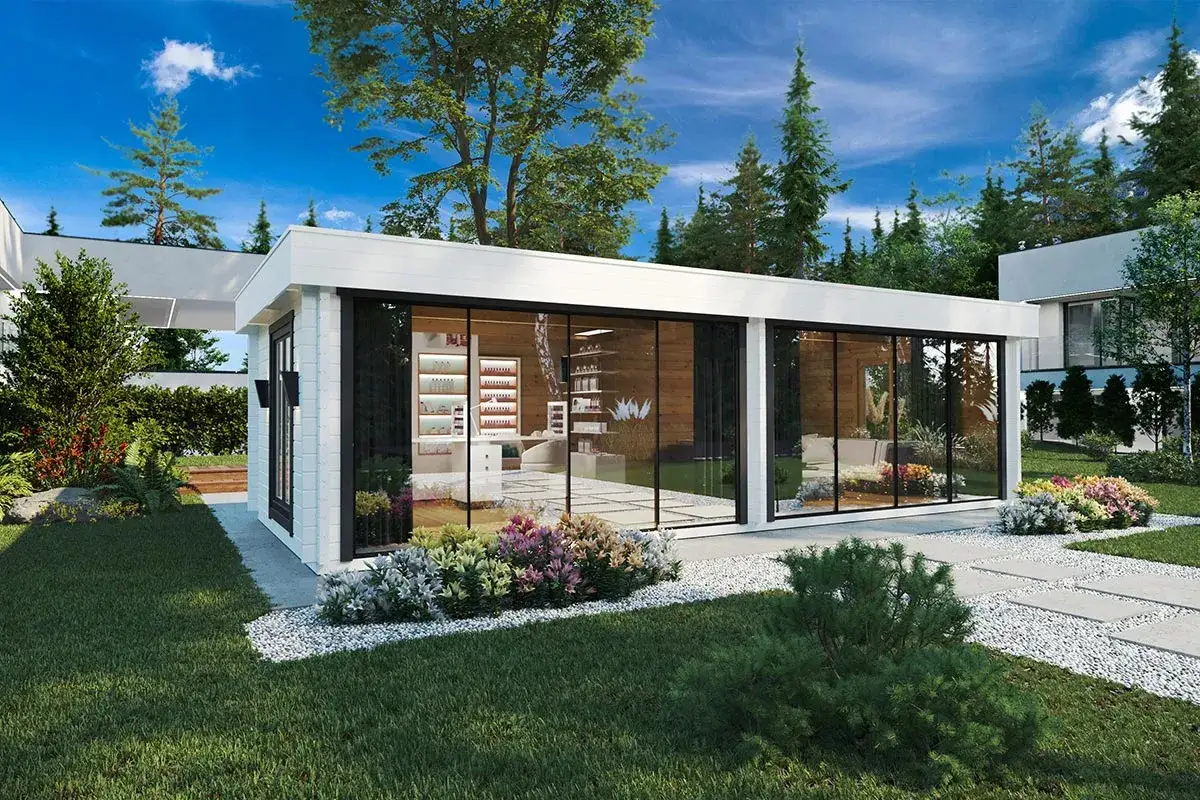 Une structure moderne avec de grandes baies vitrées, idéale pour faire une véranda lumineuse et spacieuse, entourée d'un jardin fleuri.