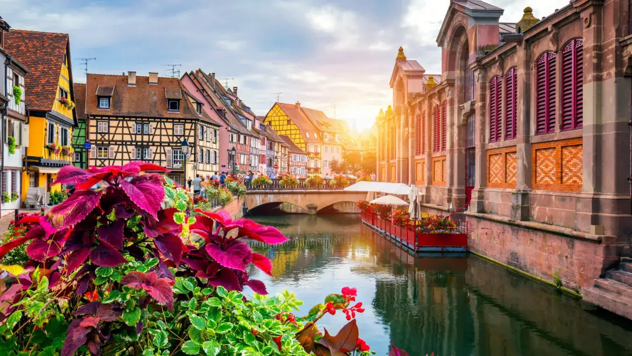 Charming canal scene with colorful buildings, perfect for day trips from Strasbourg.