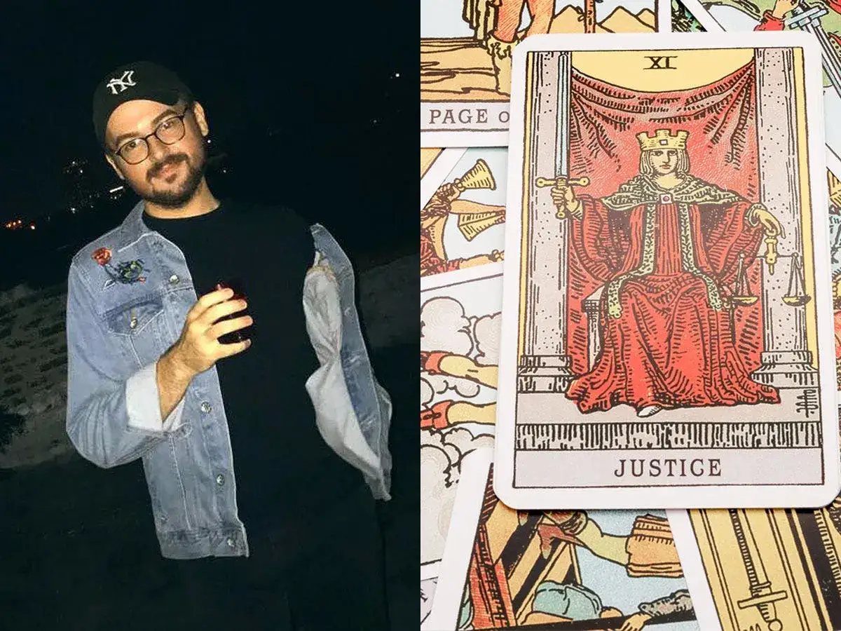 Mężczyzna z drinkiem obok karty Sprawiedliwość z talii tarota. Czy tarot się sprawdza?