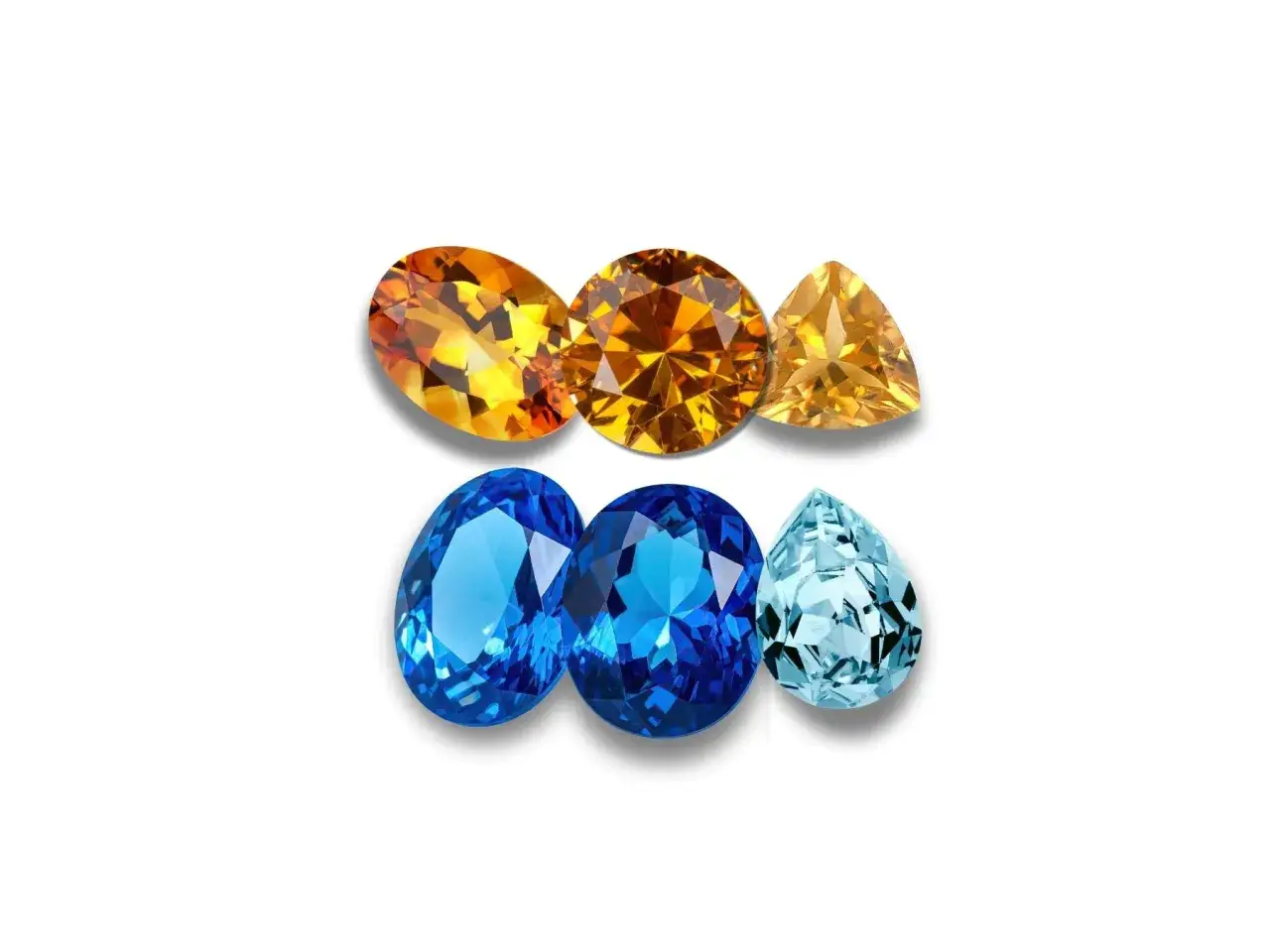 Gems in warm amber and cool blue hues, reminiscent of the november birthstone, are arranged in two rows on a white background.