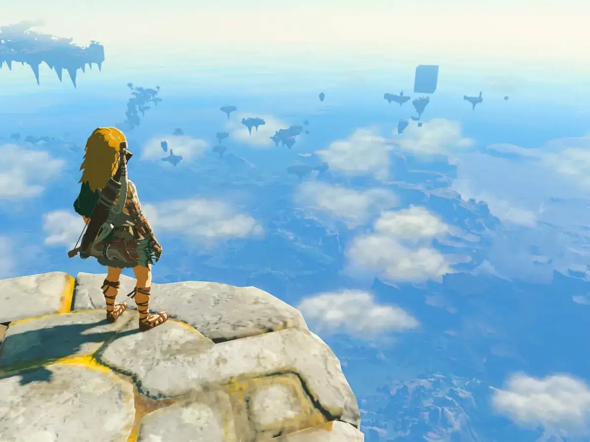 Link contempla el vasto cielo de Hyrule, un paisaje aéreo lleno de islas flotantes, perfecto para tu **guía Zelda Tears of the Kingdom**.