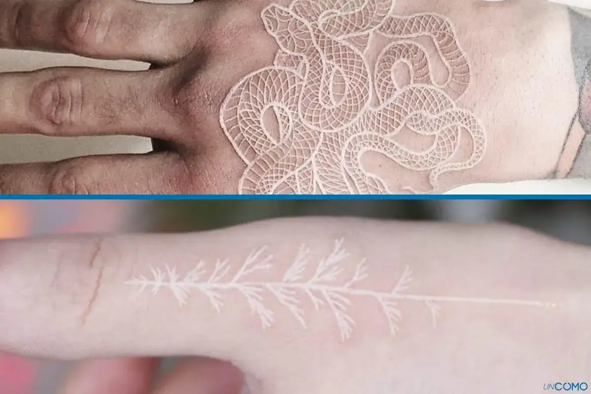 Un delicado tatuaje blanco de serpiente enroscada en una mano y una rama de árbol en un dedo.