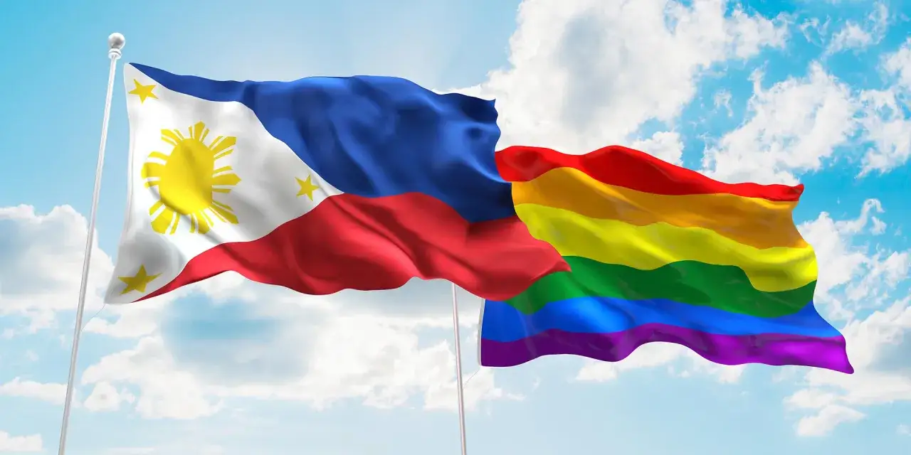 The Philippine flag waves alongside a rainbow flag, symbolizing pride and acceptance for the gay community in the Philippines.