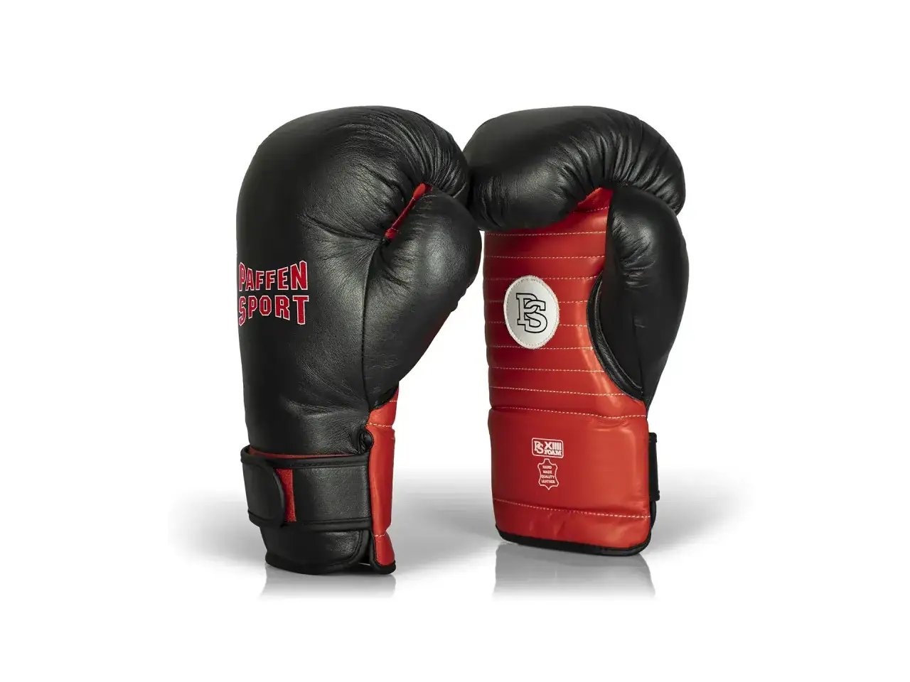 Black and red boxing gloves, a key piece of equipment for anyone learning how to be a boxing coach.