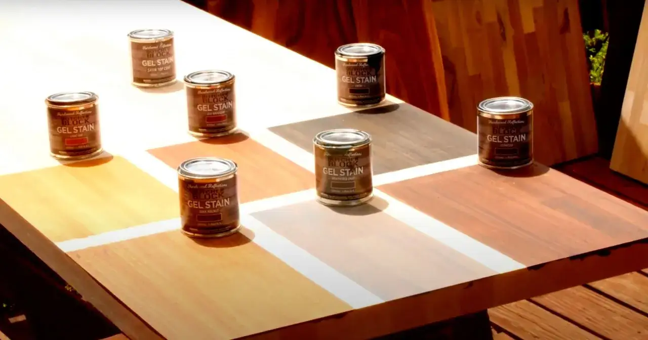 Cans of Butcher Block Gel Stain in various shades are arranged on a wooden surface, showcasing options for how to stain butcher block.