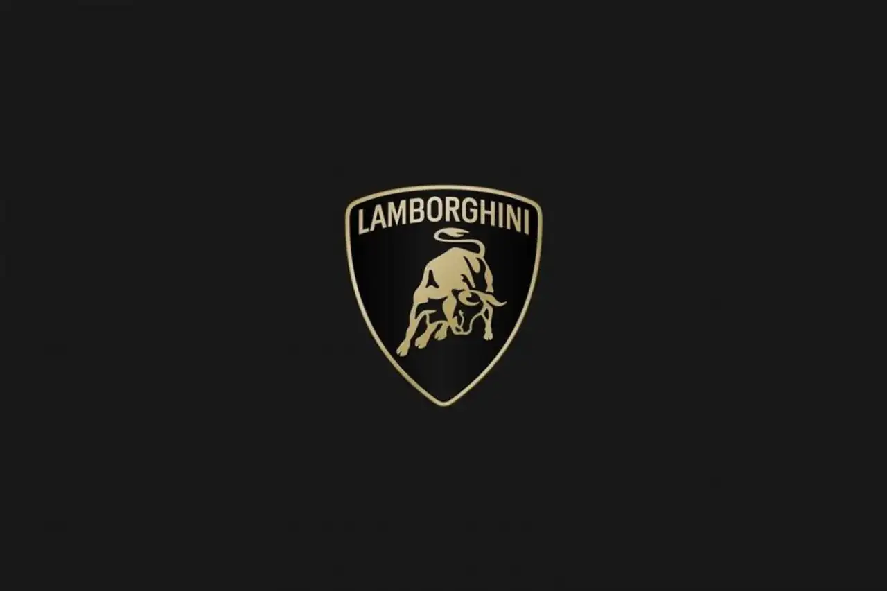 Złote logo Lamborghini z bykiem i napisem 