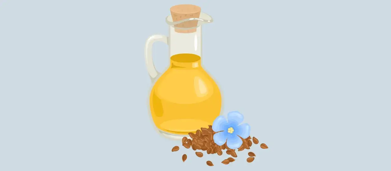 Szklana karafka z olejem lnianym, nasiona lnu i niebieski kwiatek. Olej lniany a wątroba &ndash; naturalne wsparcie.
