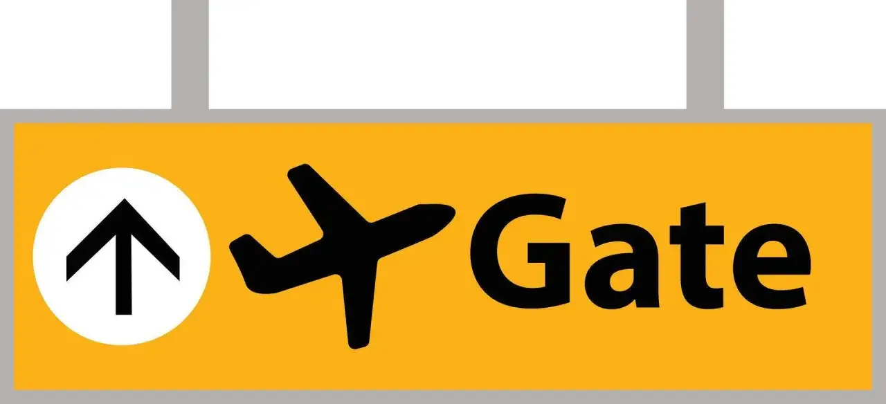 Żółty znak z czarną strzałką w górę i samolotem, wskazujący drogę do bramki na lotnisku (gate).