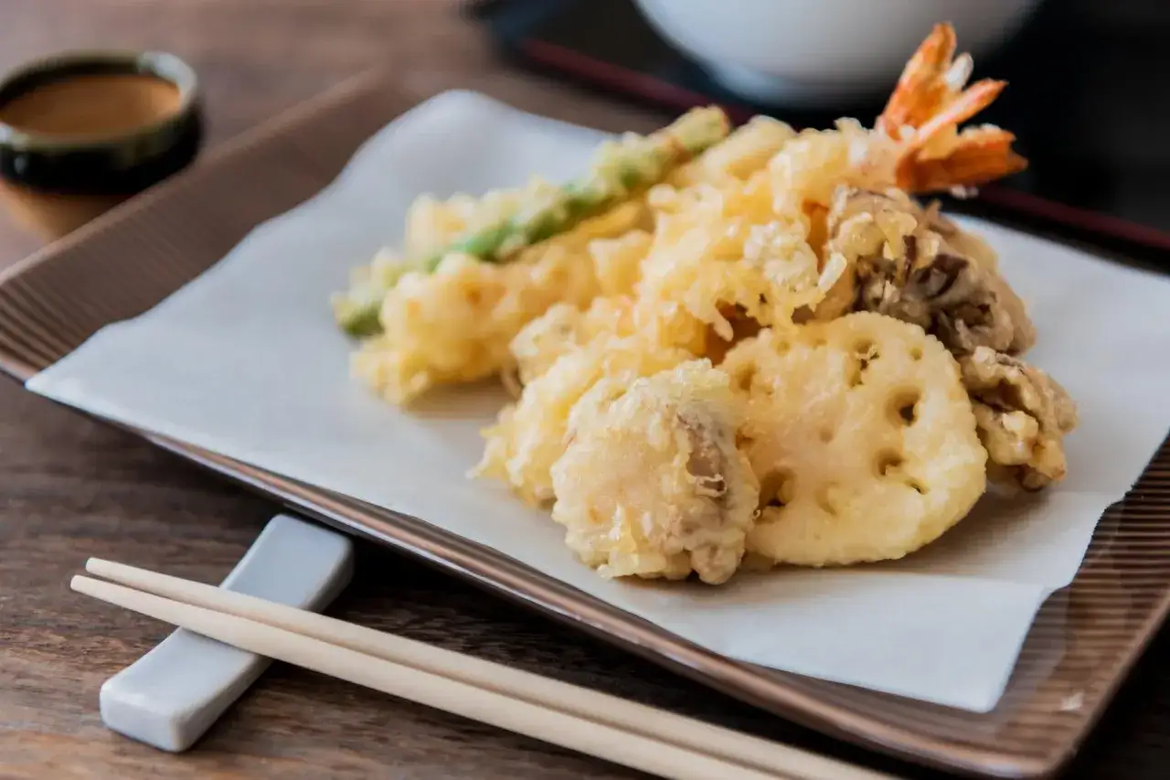 Crispy, golden tempura featuring shrimp, asparagus, and lotus root, all coated in a light, gluten free tempura batter.