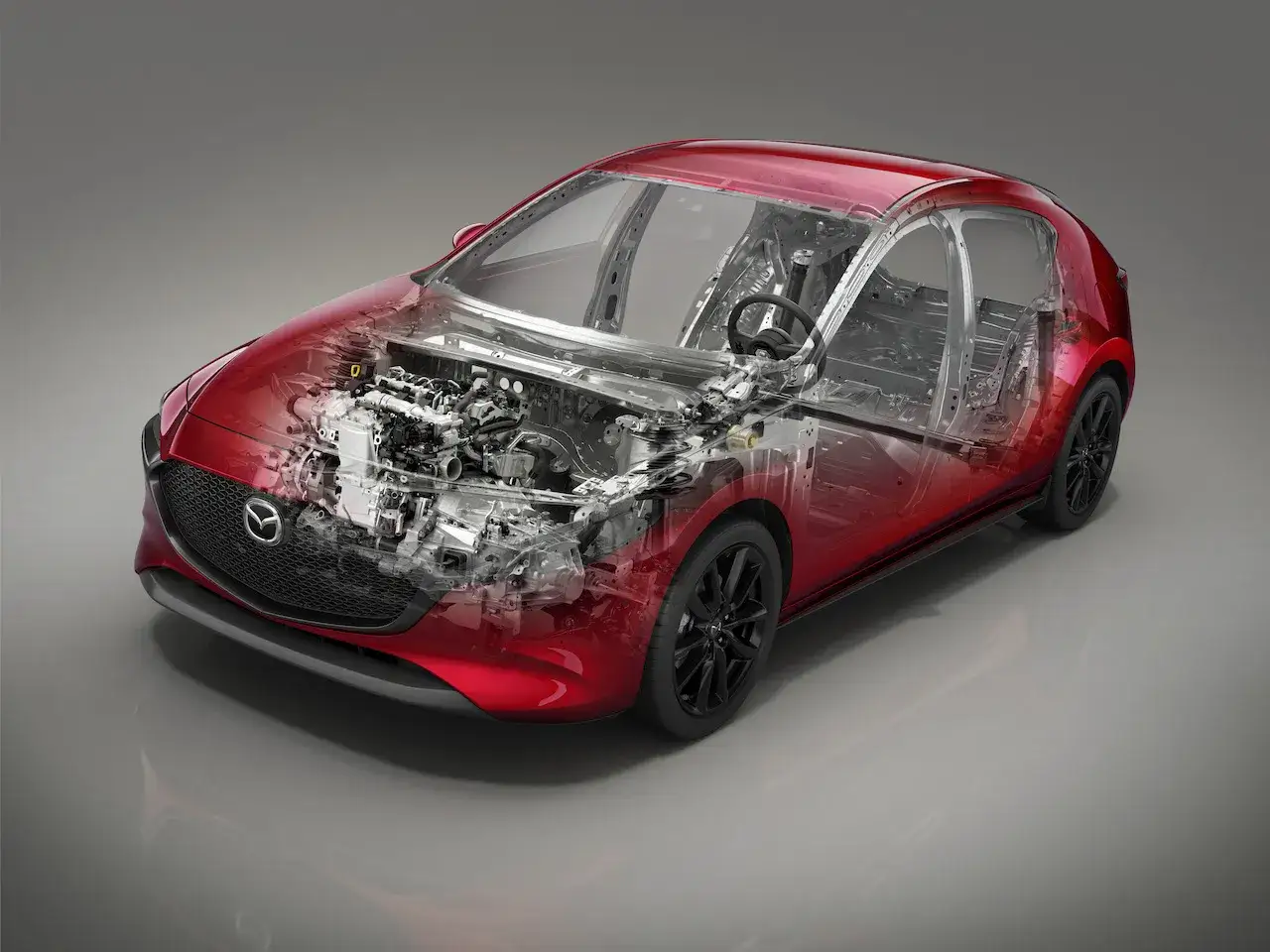 Mazda 3 Skyactiv X, un corte transversal muestra su motor y chasis.