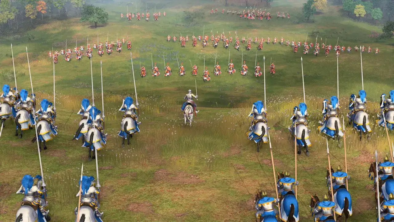 Caballería lista para la batalla en Age of Empires 4. Un ejército se prepara en un campo verde, con lanzas apuntando al cielo.