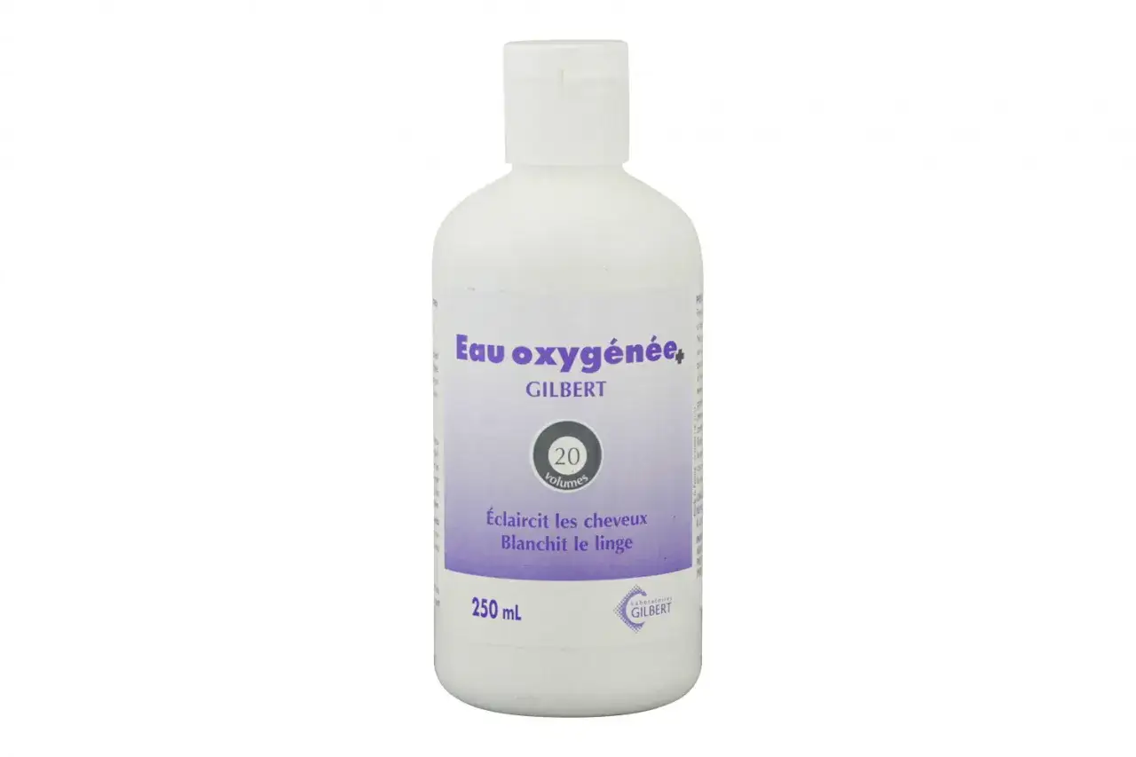 Bouteille d'eau oxygénée Gilbert 20 volumes, idéale pour éclaircir les cheveux et blanchir le linge couleur.