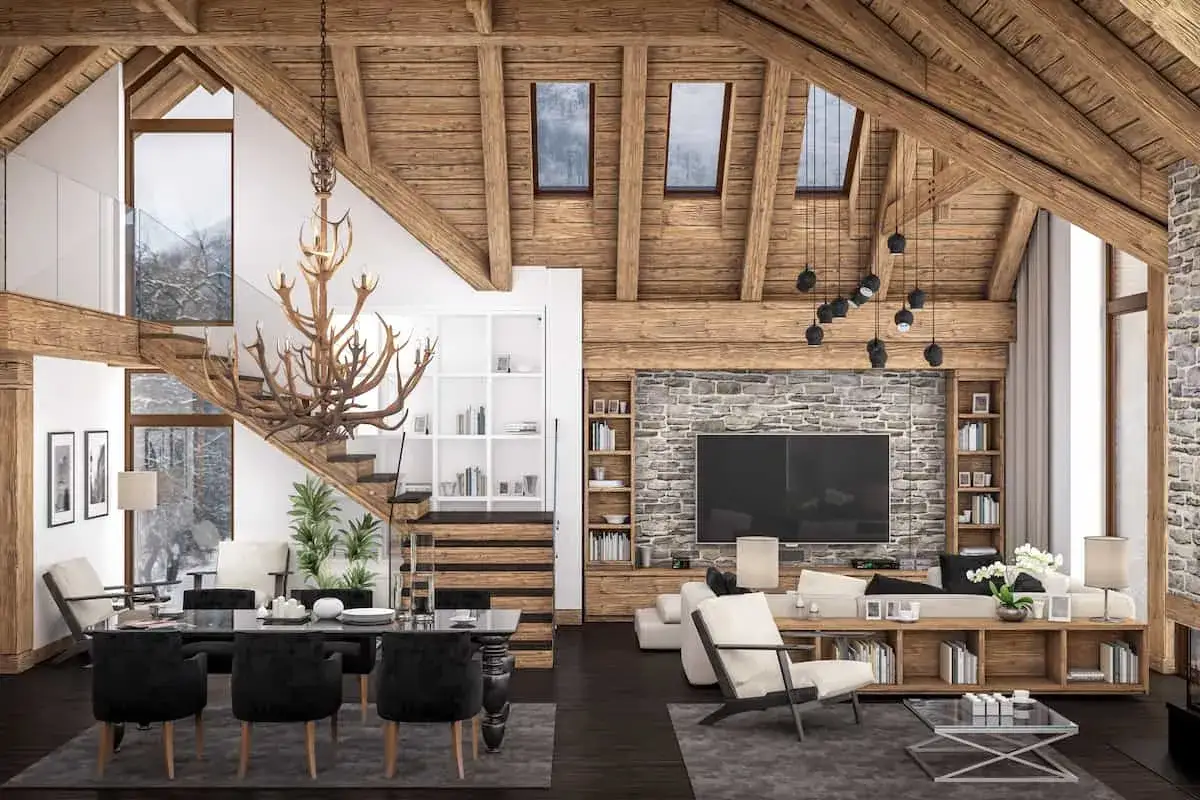 Decorar casa de pueblo con poco dinero: una casa vieja transformada en un hogar acogedor con vigas de madera, chimenea de piedra y muebles rústicos.