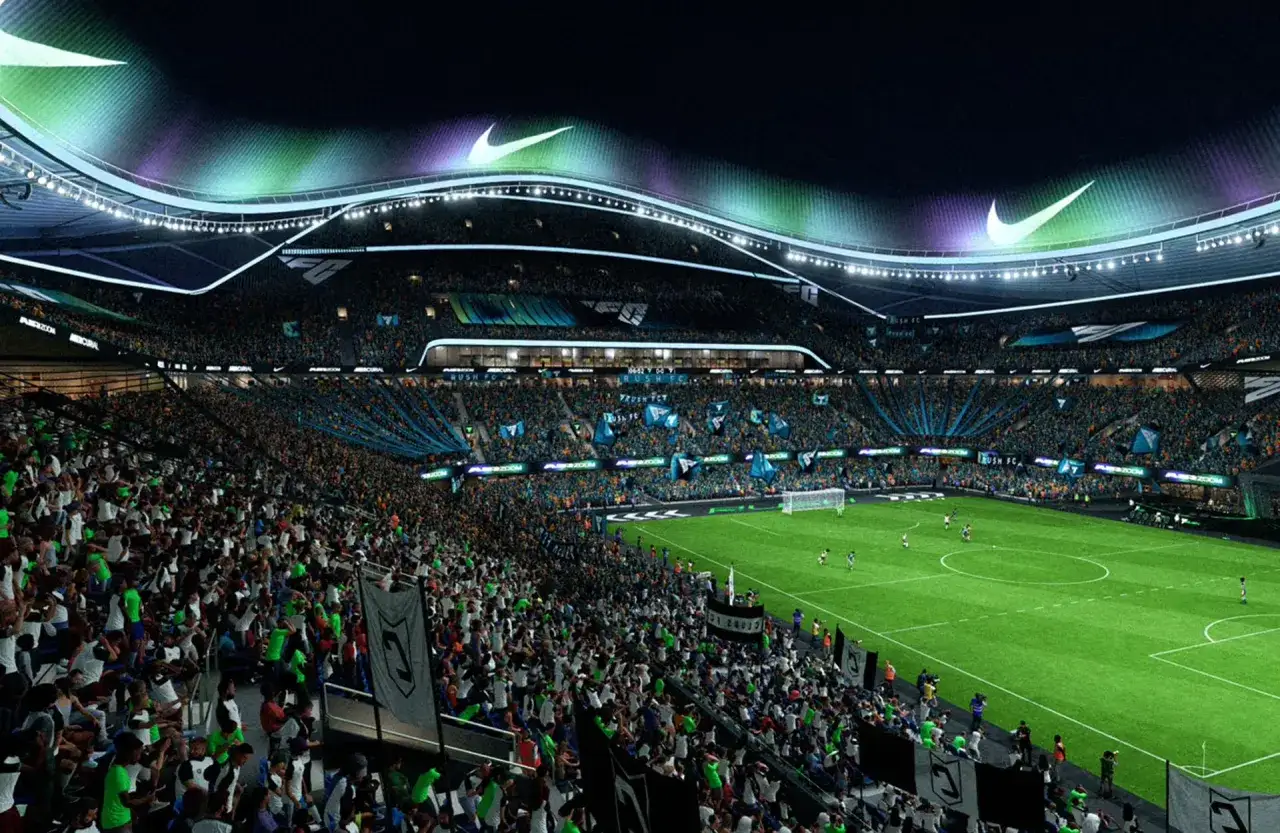 Nocny mecz na stadionie FC 25. Tłumy kibiców, zielona murawa i charakterystyczne logo Nike na dachu.