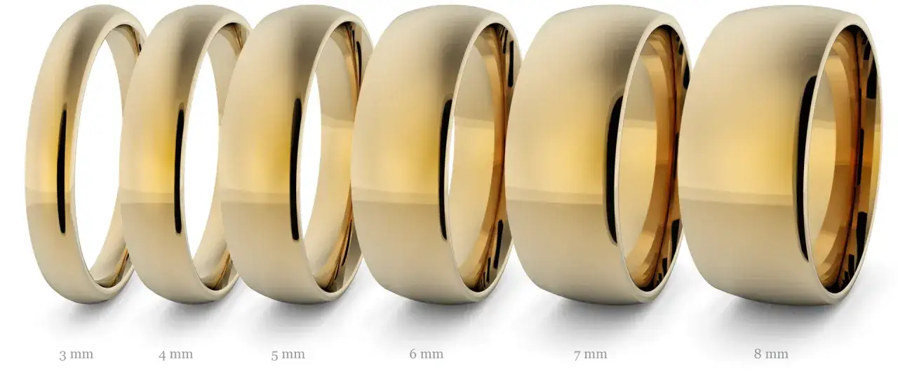 Sześć złotych obrączek o różnej szerokości (3-8 mm) prezentuje, ile wazy obrączka złota w zależności od jej rozmiaru.