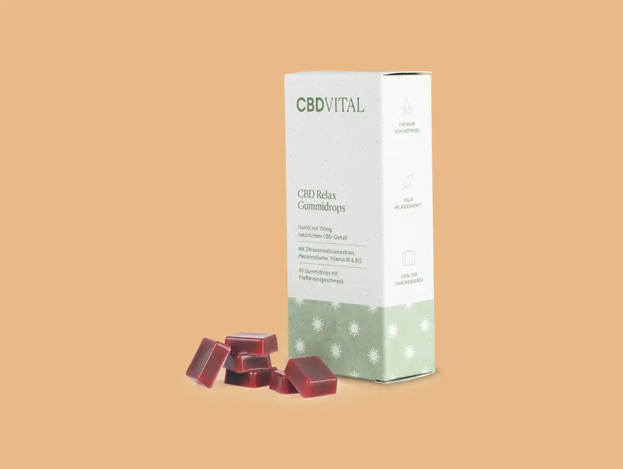 Ein Karton mit CBDVITAL Hanf Gummib&auml;rchen und ein paar Gummib&auml;rchen liegen daneben.