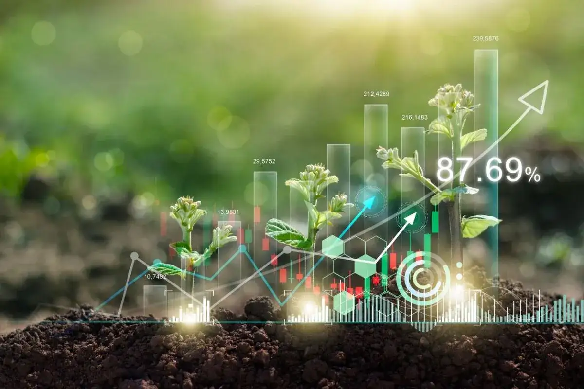 Brote de planta sobre gráfico de barras y líneas, simbolizando el crecimiento de la inversión ESG.