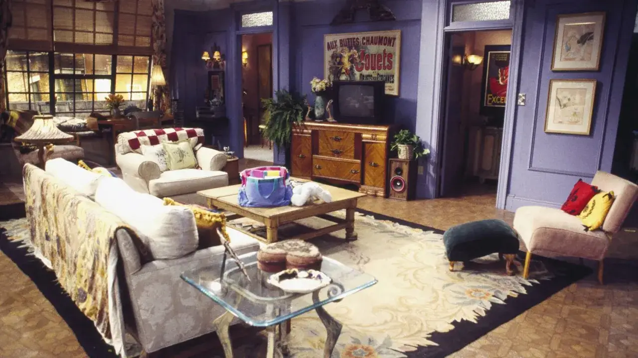 The iconic friends apartment living room, with its comfy sofas, coffee table, and eclectic decor, is ready for another gathering.