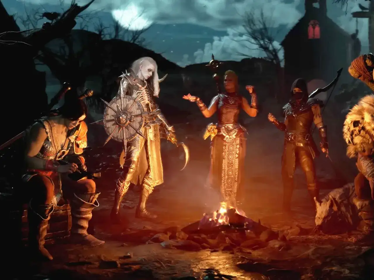 Postacie z Diablo 4 przy ognisku, gotowe na przygodę. Ten diablo 4 poradnik pomoże Ci przetrwać w Sanktuarium.