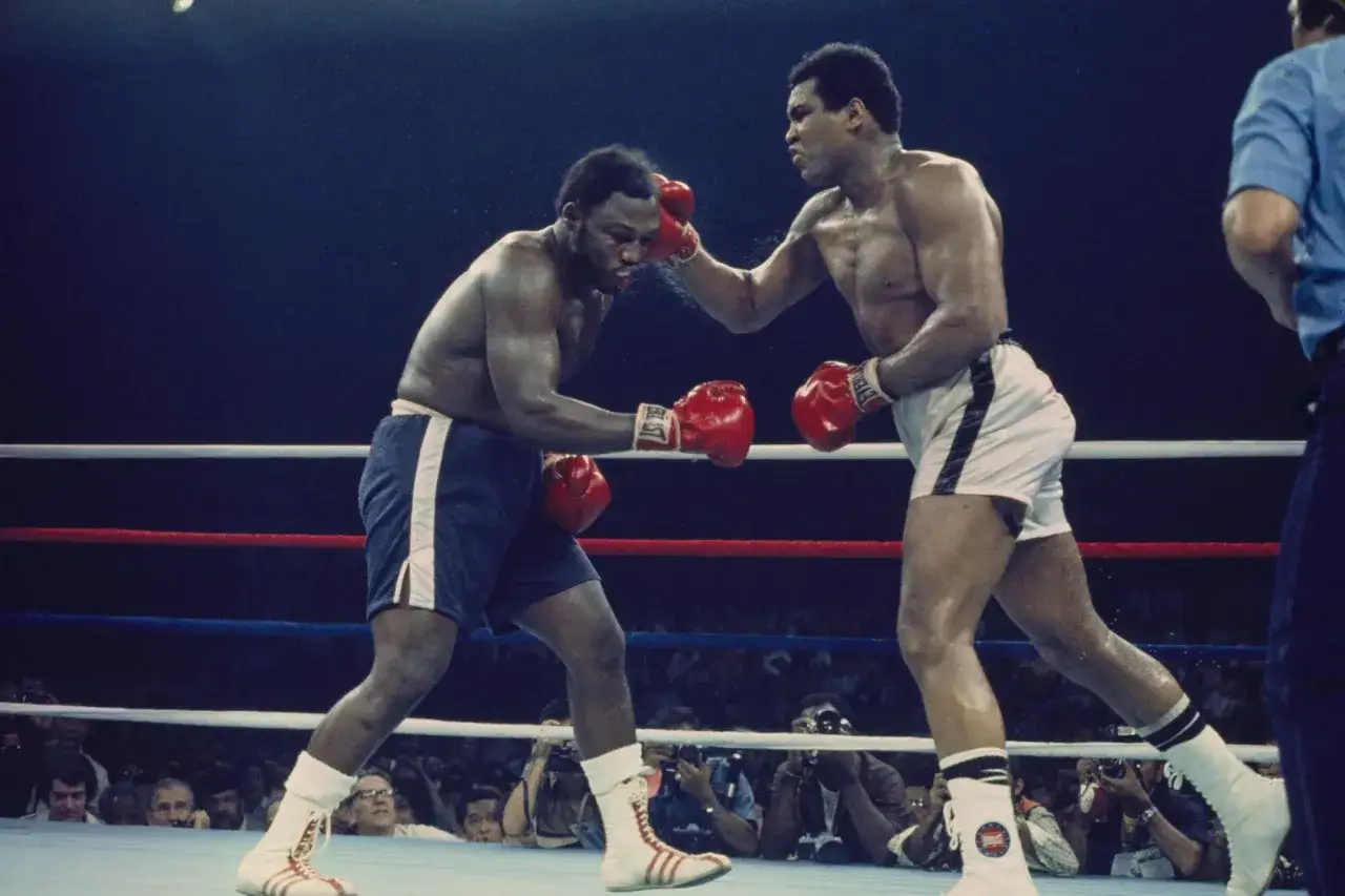 Muhammad Ali lands a punch on Joe Frazier, two of the best P4P boxers of all time, in a legendary bout.