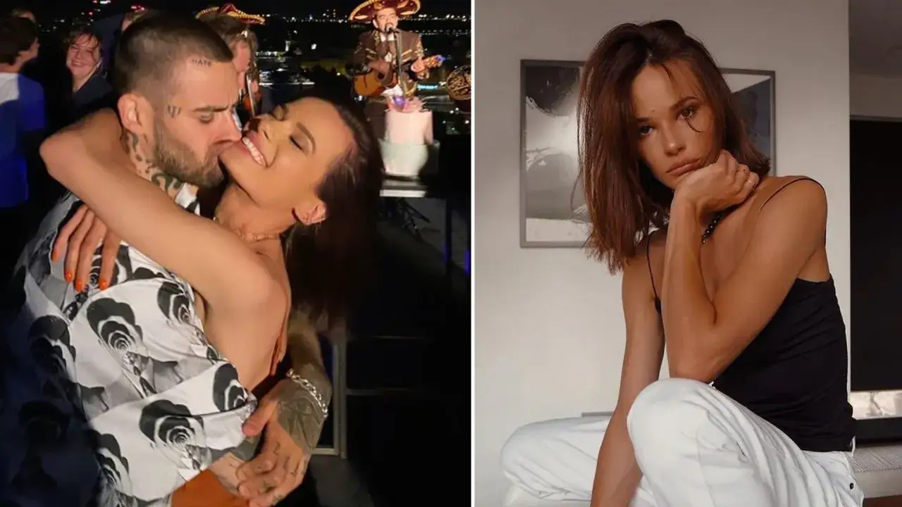 Quebonafide i Natalia Szroeder w czułym uścisku na imprezie. Obok Natalia w czarnej bluzce i białych spodniach.