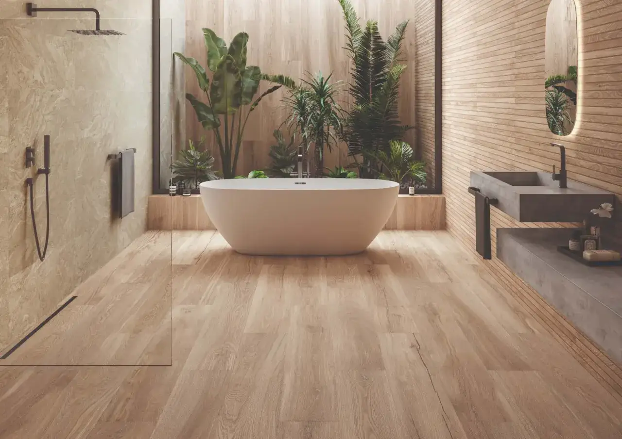 Ba&ntilde;o moderno con ba&ntilde;era exenta, ducha y lavabo. El suelo de madera se instala primero, luego los azulejos de pared.