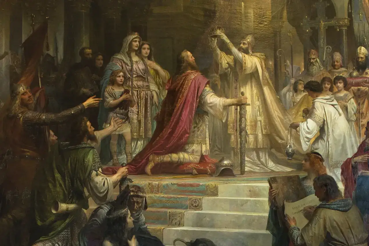 Kr&ouml;nung Karls des Gro&szlig;en im Jahr 800 nach Christus. Ein Mann kniet, w&auml;hrend ihm eine Krone aufgesetzt wird.