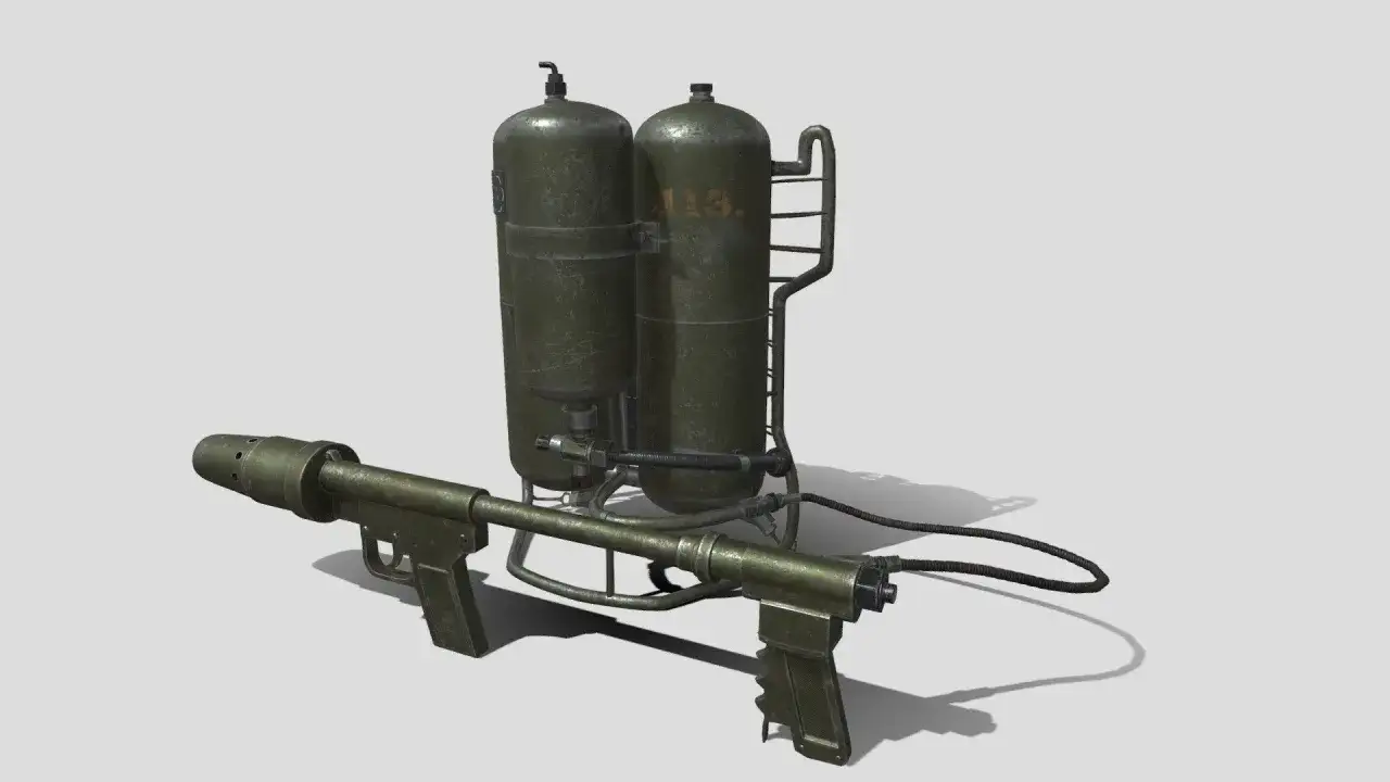 Ein Flammenwerfer aus dem 2. Weltkrieg, mit zwei grünen Tanks und einem langen Rohr mit Griffen.