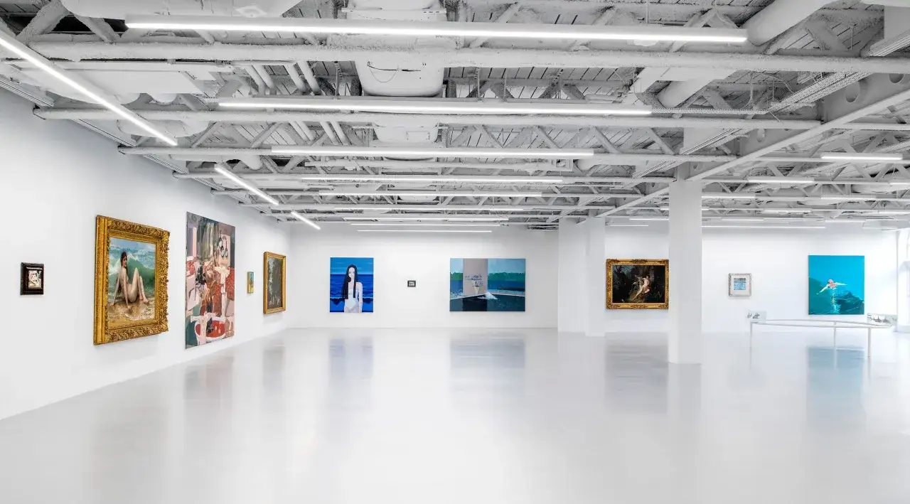 A bright, modern gallery space showcasing diverse paintings, a testament to the vibrant London art scene.