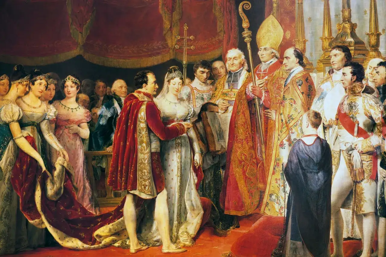 Le couronnement de Napol&eacute;on et Marie-Louise, entour&eacute;s de dignitaires. L'empereur, en manteau rouge, tend la main &agrave; sa nouvelle &eacute;pouse.
