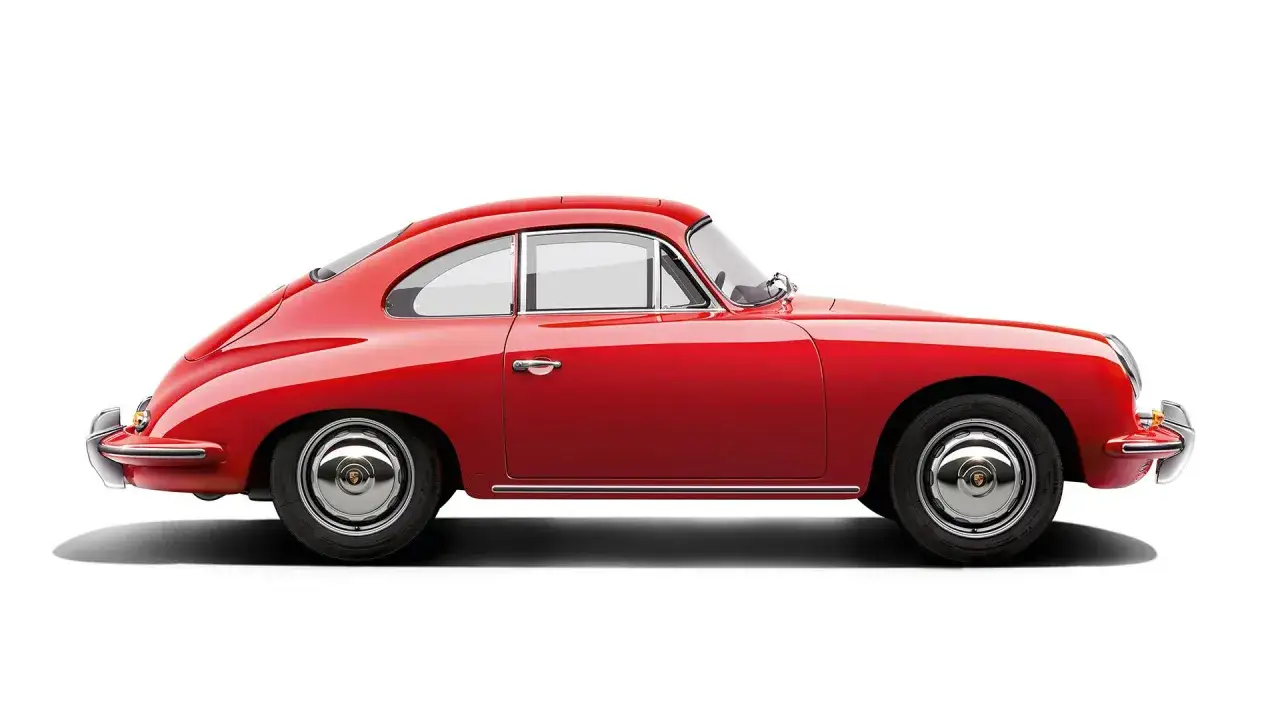 Klasyczny, czerwony Porsche 356, ikona motoryzacji, prezentuje swoje eleganckie linie na białym tle.