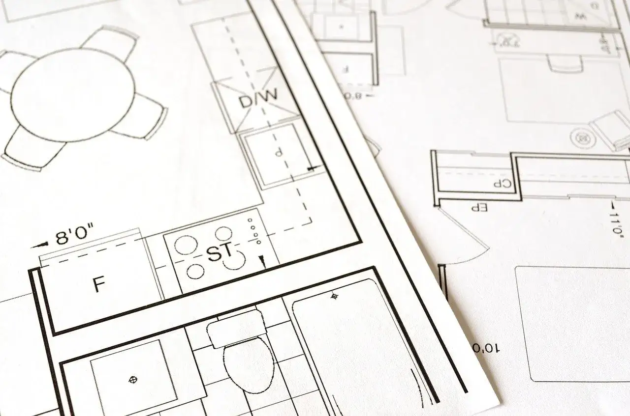 Plany architektoniczne, w tym kuchnia i łazienka, sugerują podział wspólnoty mieszkaniowej.