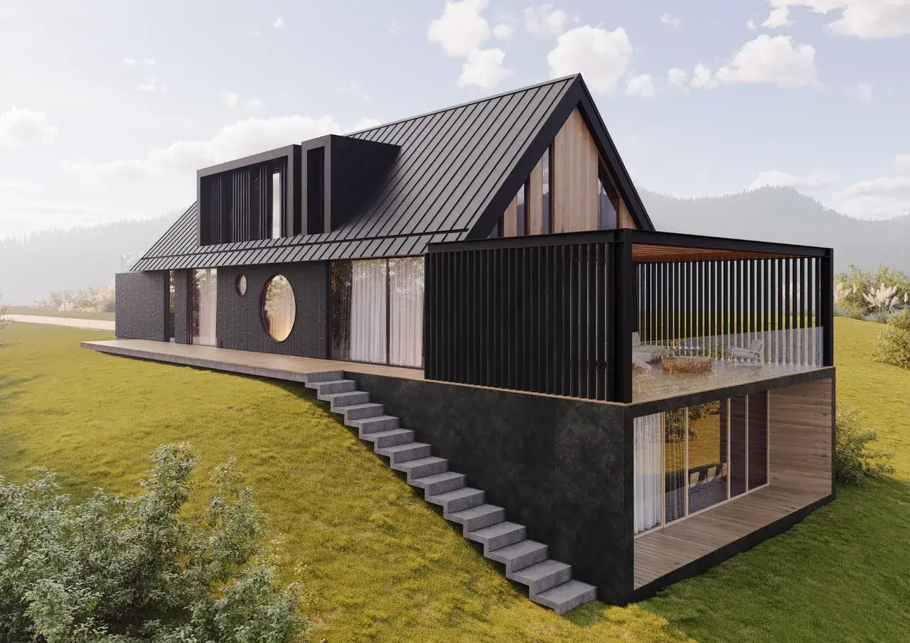 Nowoczesny dom na zboczu, z tarasem i okrągłym oknem. Woda deszczowa spływa po dachu, a jej odpływ, czyli rzygacz, jest dyskretnie wkomponowany w architekturę.