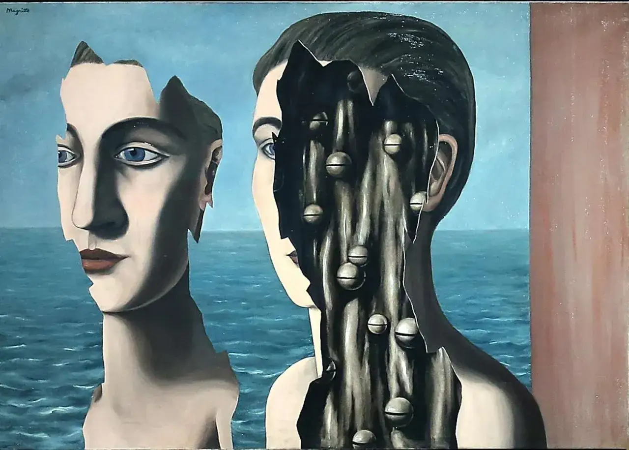 Dwie połówki twarzy, jedna gładka, druga z wnętrzem pełnym kulek, na tle morza. To przykład, czym jest surrealizm.