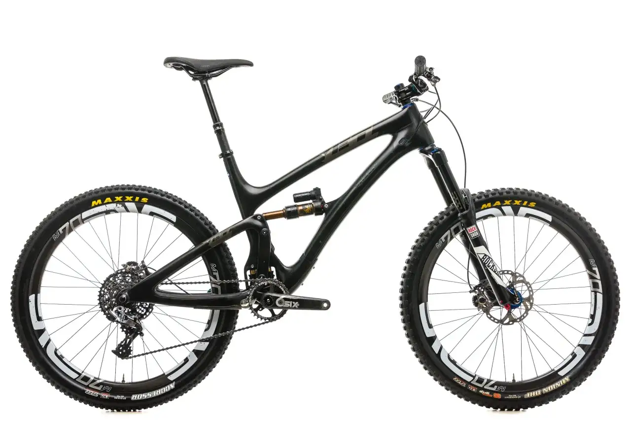 A black Yeti SB6c mountain bike with Maxxis tires and RockShox suspension, ready for any trail.