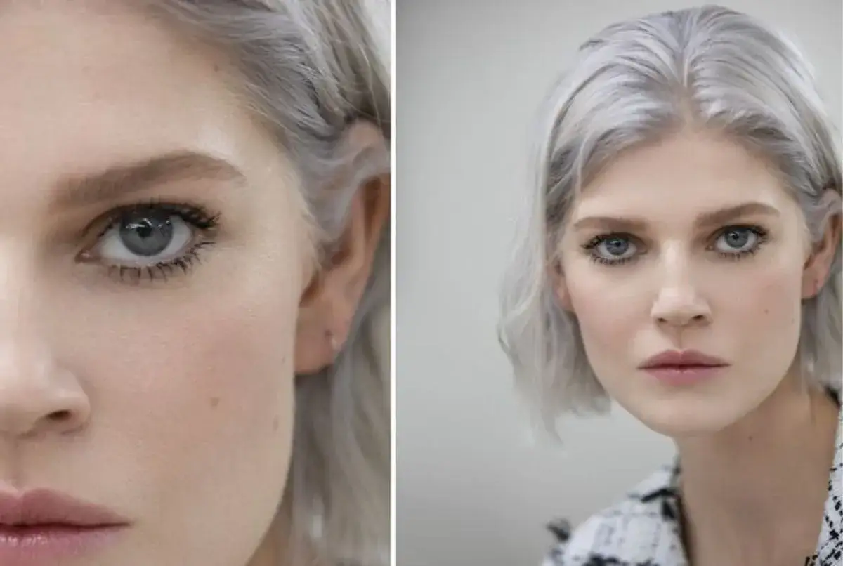 Maquillage subtil sur une jeune femme aux cheveux gris argent&eacute; et aux yeux marrons per&ccedil;ants.
