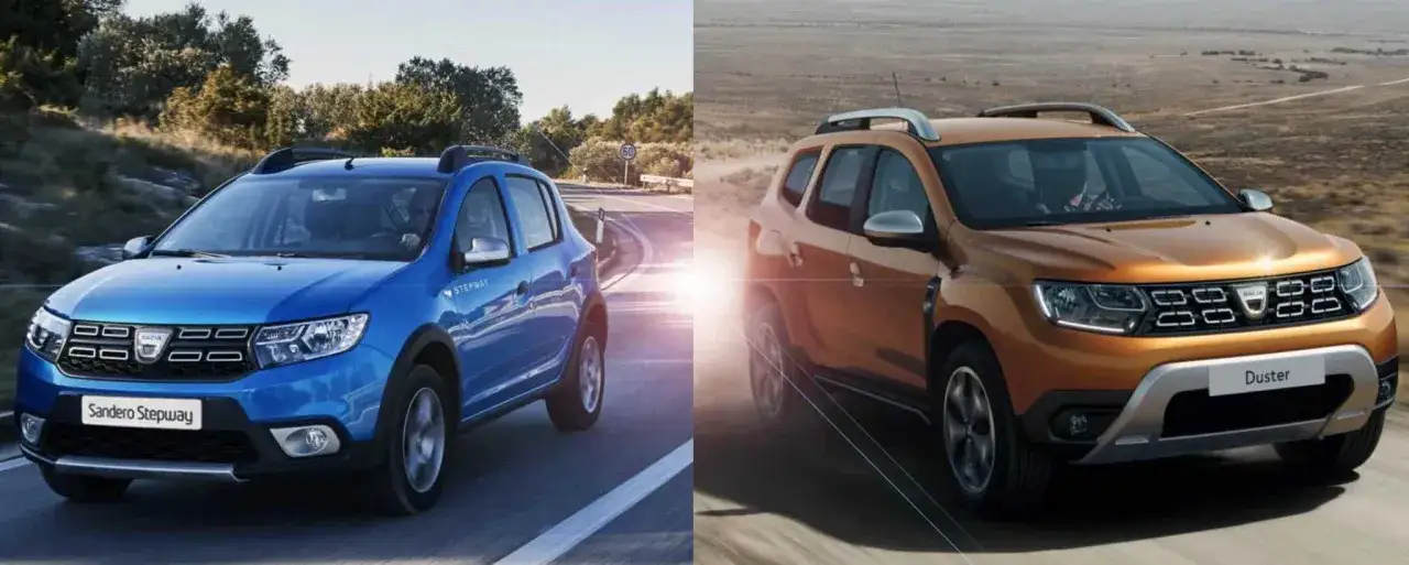 Niebieski Sandero Stepway i pomarańczowy Duster jadą drogą. Dacia Stepway to wszechstronny samochód.