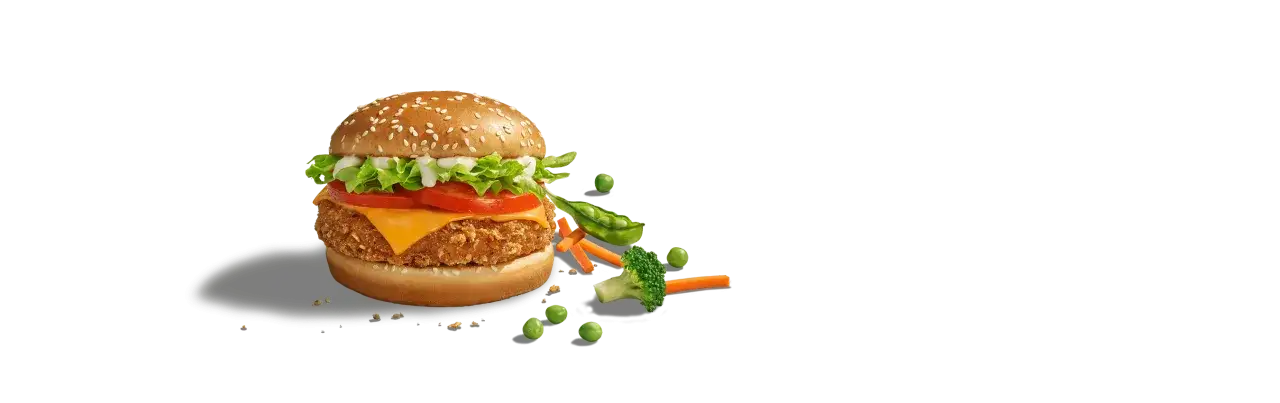 Pyszny wege burger McDonald's z chrupiącym kotletem, serem, warzywami i sosem. Idealny wybór dla miłośników roślinnych smaków.