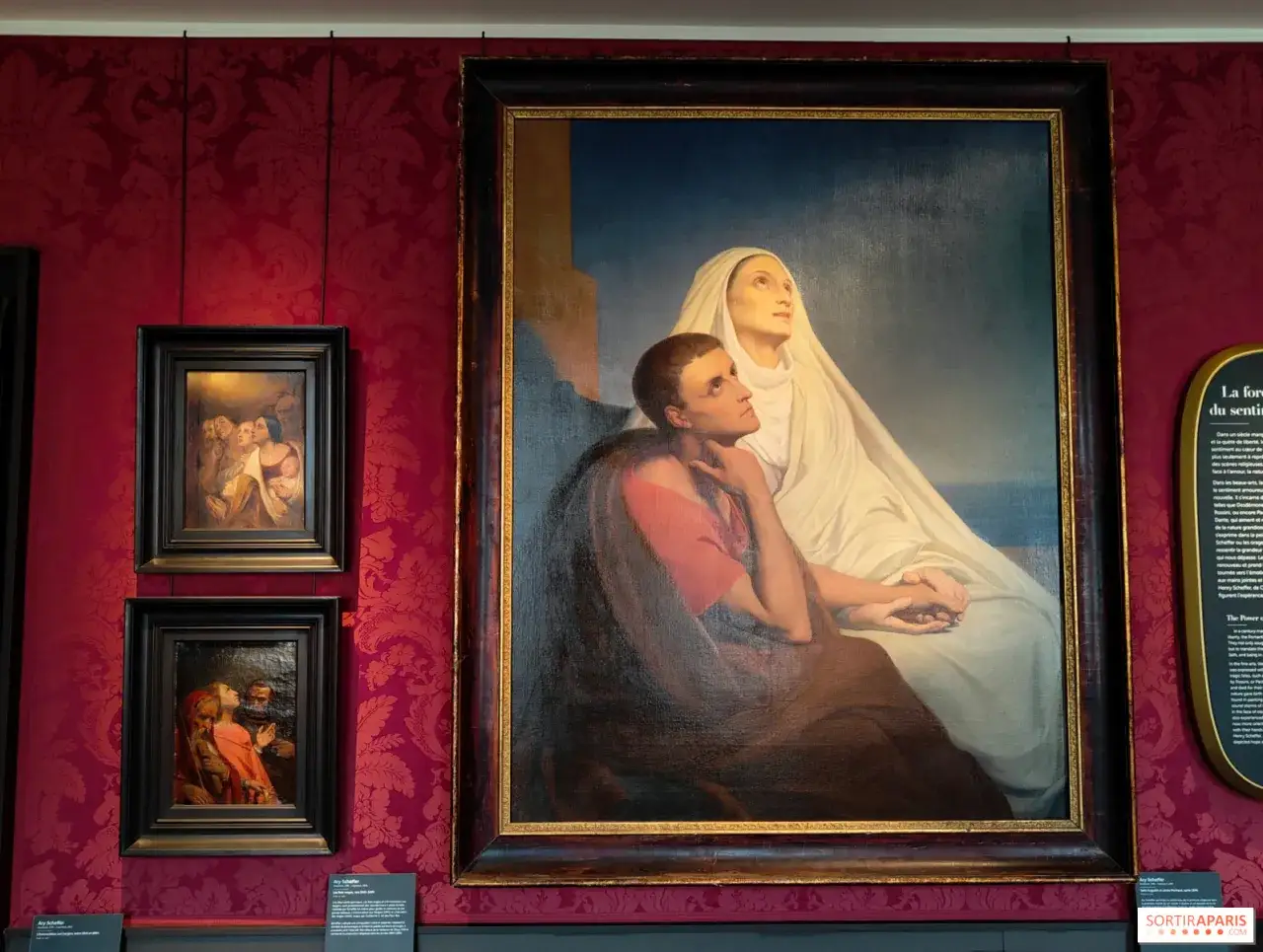 Gemälde von Ary Scheffer: Eine Frau in Weiß und ein Mann in Rot blicken hoffnungsvoll nach oben.