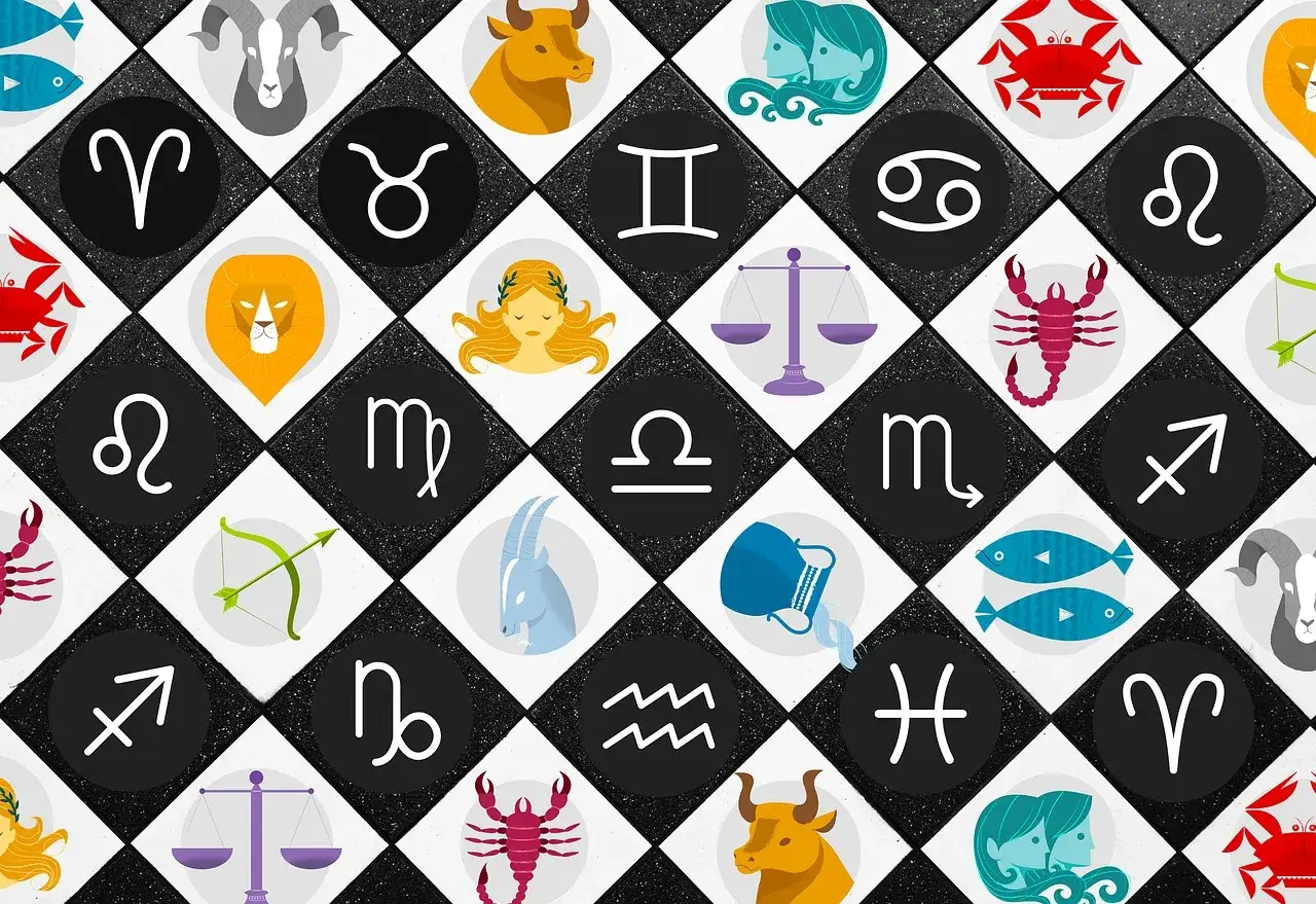 Znak zodiaku **październik** to Waga lub Skorpion. Wizerunki wszystkich znaków zodiaku na czarno-białej szachownicy.