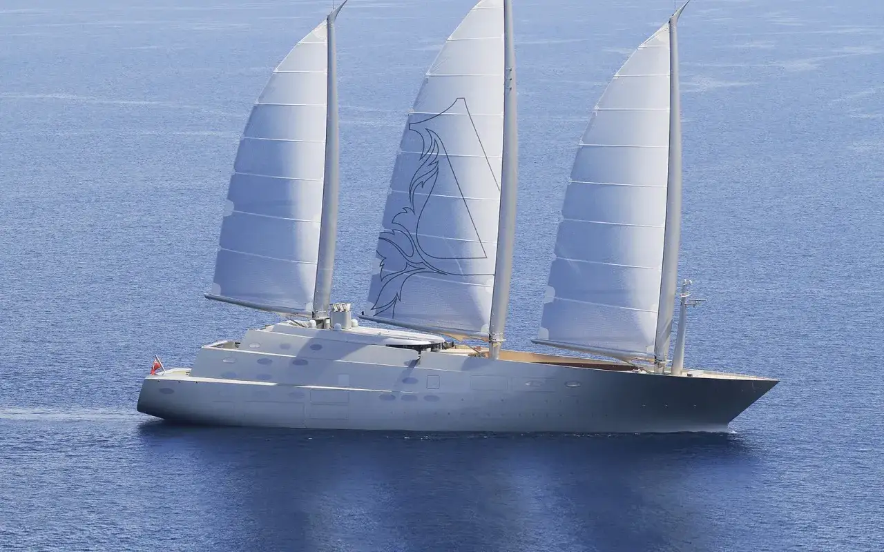 Ein elegantes Segelschiff mit drei Masten gleitet über das blaue Meer. Die Segel sind mit einem stilisierten Muster verziert, das an eine **sy**mbolische Darstellung erinnert.
