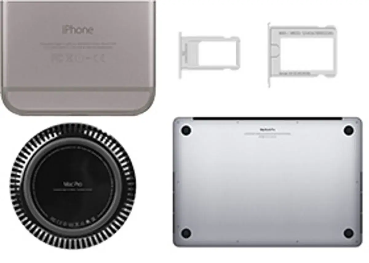 Spód MacBook Pro z widocznym numerem seryjnym, iPhone, tacki SIM i okrągły Mac Pro.