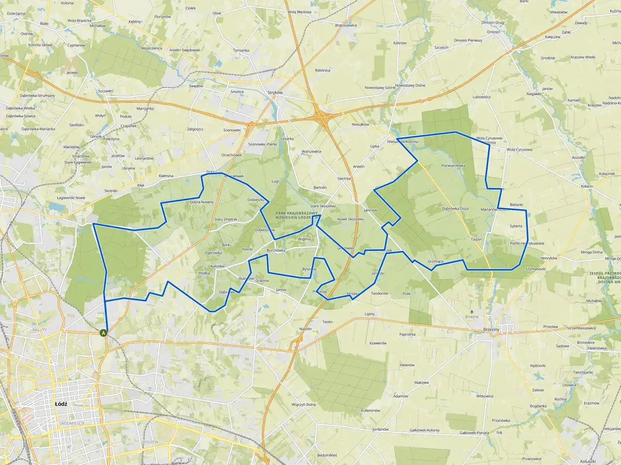 Mapa z zaznaczoną trasą rowerową wokół Łodzi, przechodzącą przez tereny zielone i miejscowości.