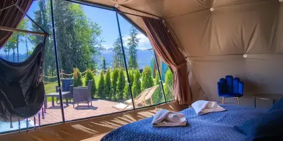 Unique accommodation types in Poland (e.g., agrotourism farm, glamping tent, treehouse, modern hostel interior)