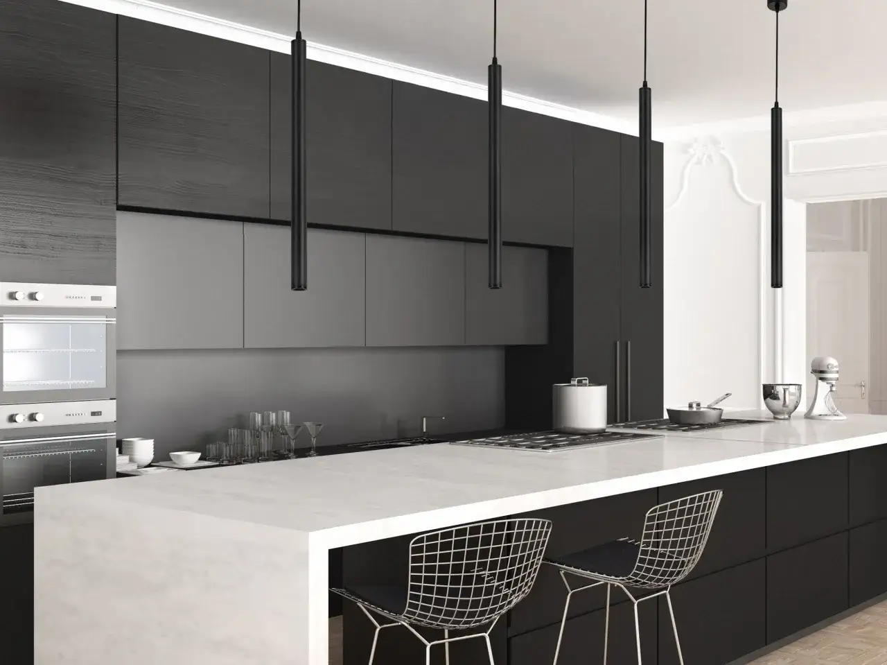 Nowoczesna kuchnia z czarnymi szafkami i wyspą. Nad nią wisi elegancka lampa sufitowa tuba, oświetlając blat.