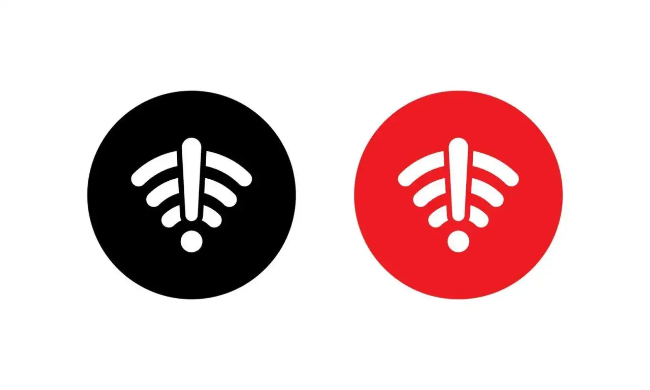 Dwa okręgi z ikoną Wi-Fi. Czerwony okrąg z wykrzyknikiem przy zasięgu sieci oznacza problem z połączeniem.
