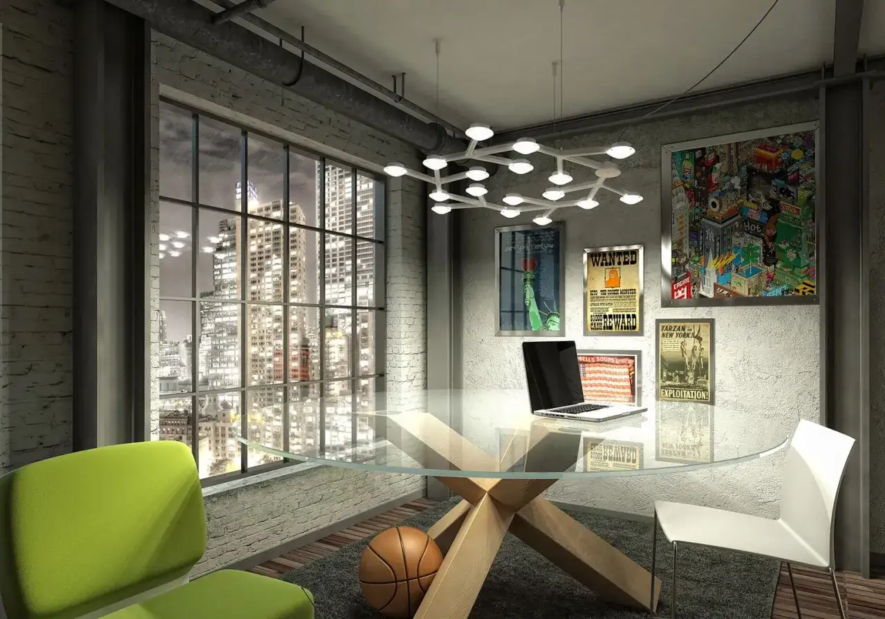 Nowoczesne biuro z widokiem na nocne miasto. Centralnym punktem jest szklany st&oacute;ł z laptopem. Nad nim wisi lampa, kt&oacute;ra wyjaśnia, że led zintegrowany to nowoczesne oświetlenie.