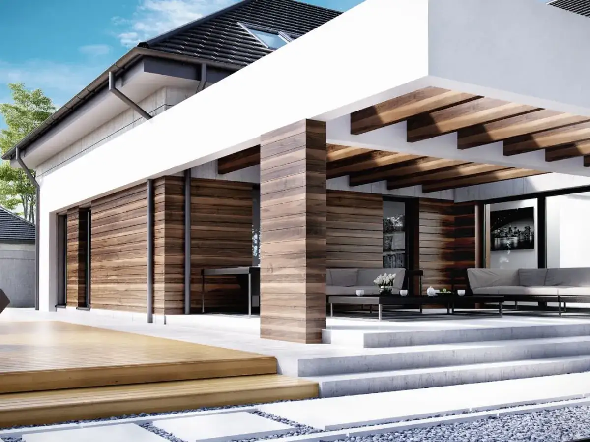Nowoczesny dom z drewnianą elewacją i tarasem. Malowanie elewacji domu wzory z drewna nadaje mu ciepły, naturalny wygląd.