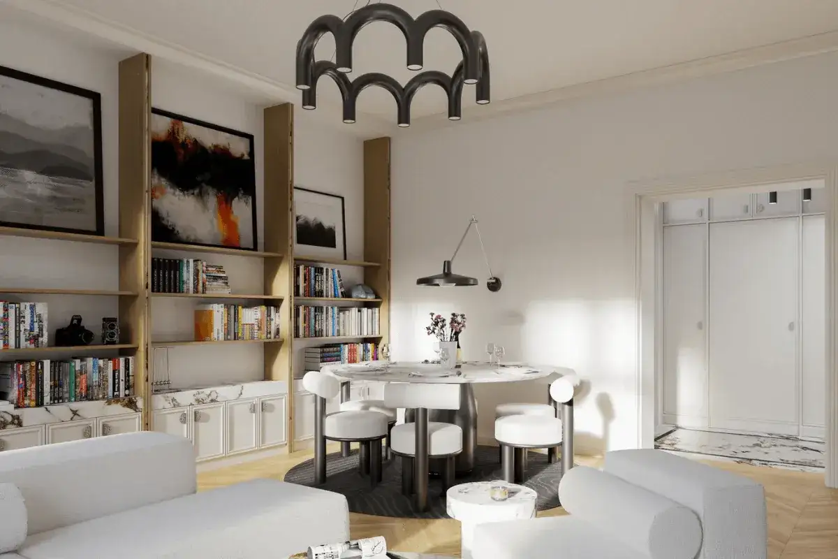 Nowoczesne wnetrza domu: białe sofy, okrągły stół z krzesłami, regały z książkami i sztuką, designerska lampa.