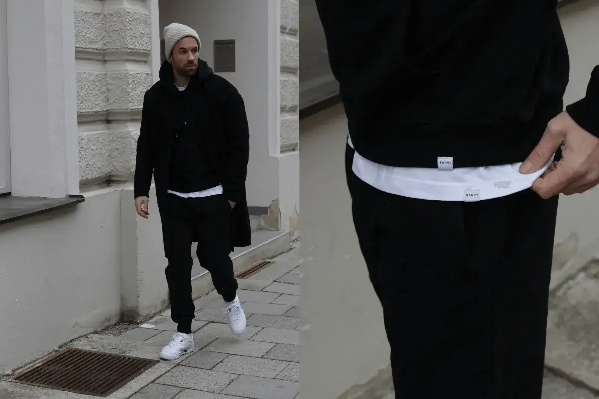 Mann tr&auml;gt modernen Jogg-Suit Anzug in urbaner Umgebung